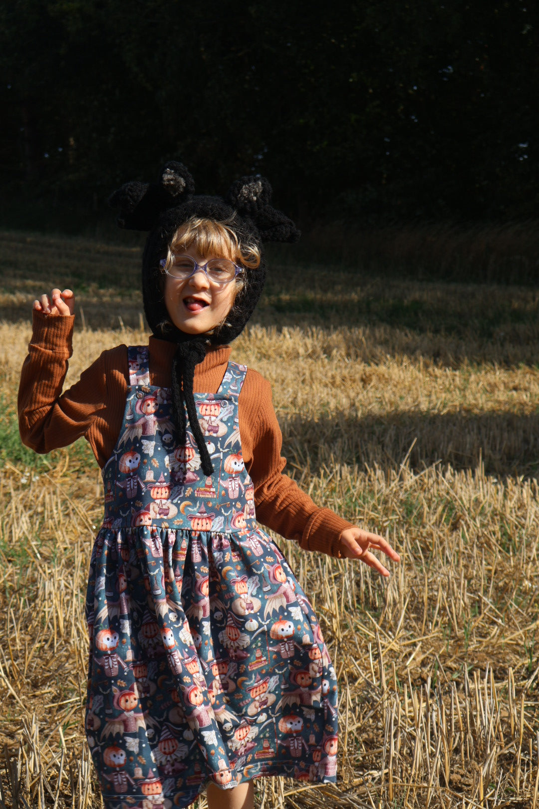 Clowns and skeletons pinafore dress